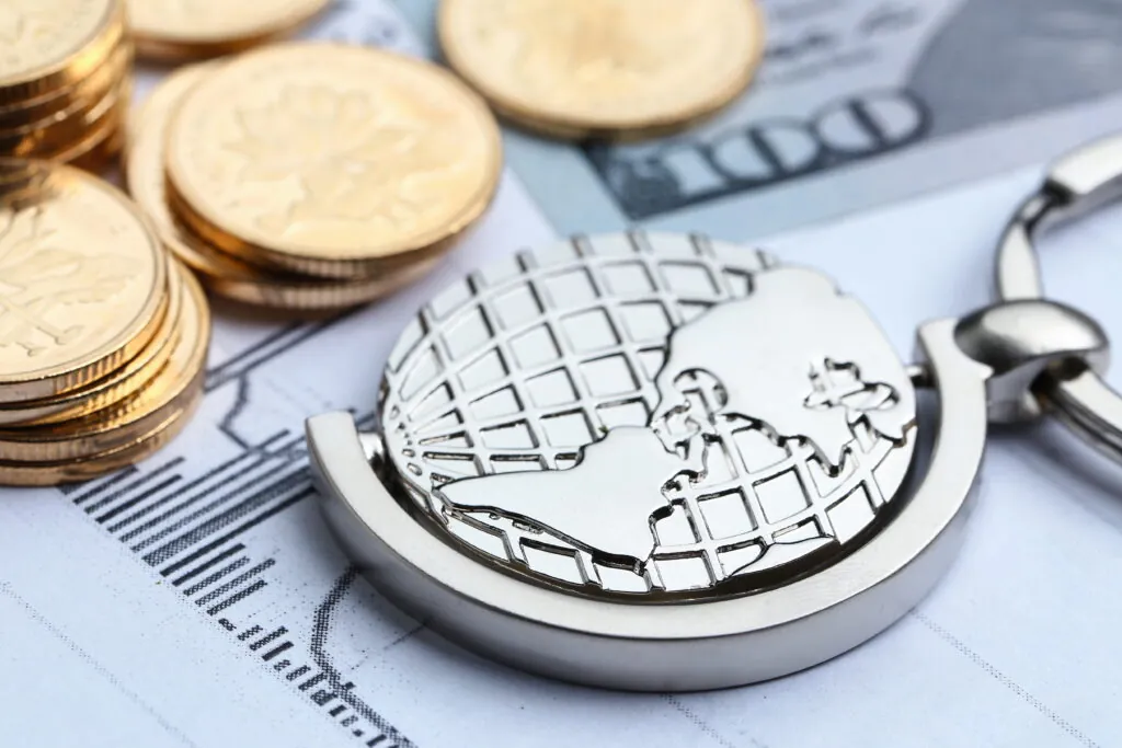 coins, paper money and globe on white statistic form background